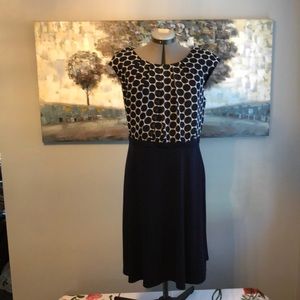 Navy blue with white polka dots and beautiful pleated neck detail Aline